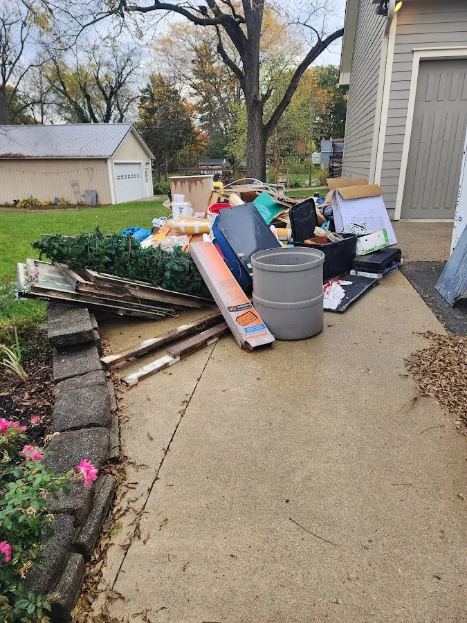 Dumpster being loaded with debris for 3 Yard Dumpster Rental in Garfield Heights